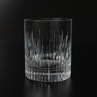 Crystal glass with intricate design on a black background