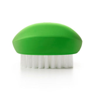 Flexible non-slip vegetable brush resting in hand