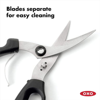 OXO Poultry Shears cutting raw chicken breast cleanly

