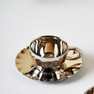 Stainless steel cup and saucer set